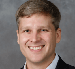E. Mark Curtis